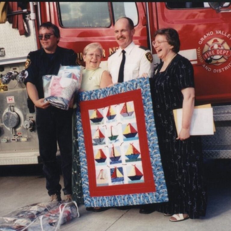 Scott Benham Pat Kalapaca  Fire Chief McKinney  Leah Mitchell- Donation of Children’s quilts to the Grand Valley Volunteer Fire Department
